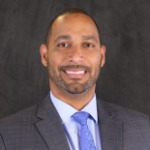 A headshot of Moises Feliz, the AVP of Lending/Office Manager at Mati Trust Financial .